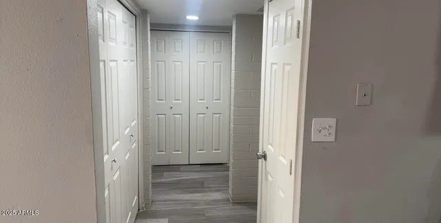 a white toilet sitting next to a bath tub