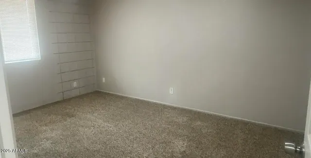 an empty room with a empty space and window