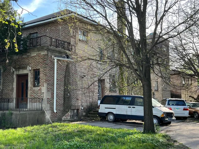 a car parked in front of a house