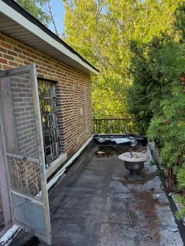 a view of hallway with wooden floor