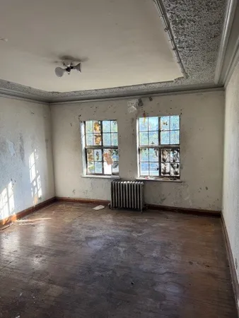 a view of an empty room with a window