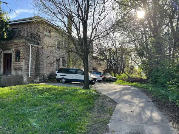 a view of a house with a back yard