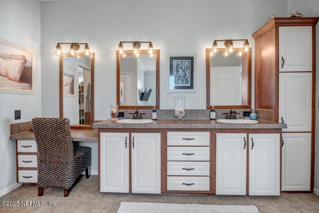 1417 Marlee Road St. Johns, FL 32259 - Photo 35 of 70 a bathroom with a double vanity sink and a mirror