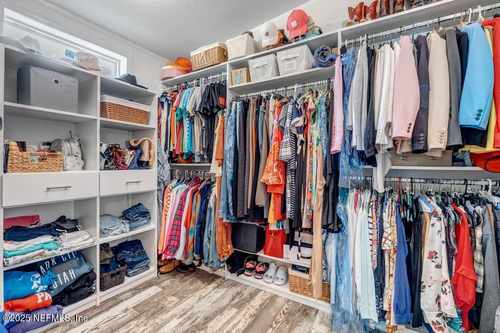 1417 Marlee Road St. Johns, FL 32259 - Photo 37 of 70 a view of walk in closet with clothes and shoes