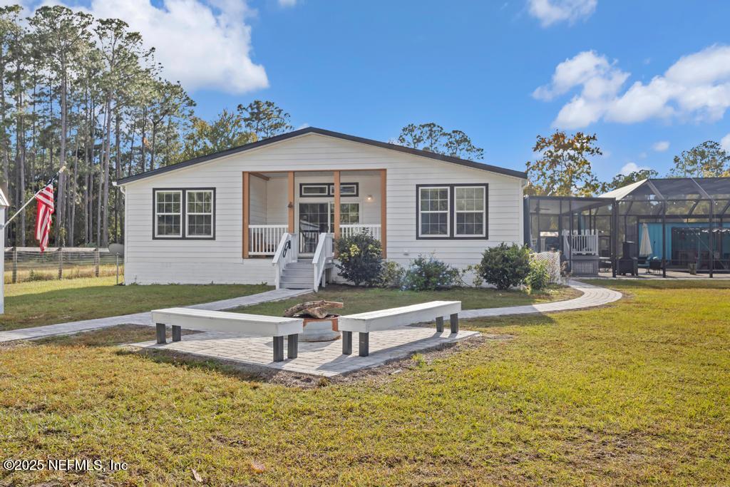1417 Marlee Road St. Johns, FL 32259 - Photo 46 of 70 a view of a house with swimming pool and a yard