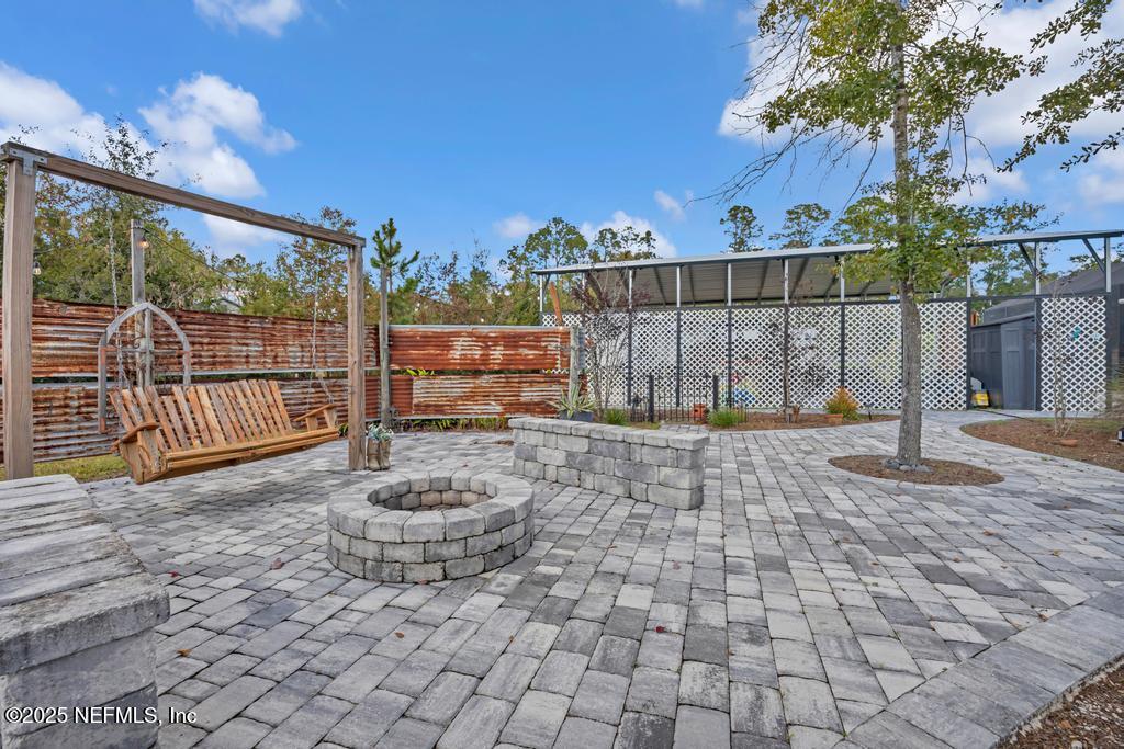 1417 Marlee Road St. Johns, FL 32259 - Photo 54 of 70 a view of a backyard with a iron fence