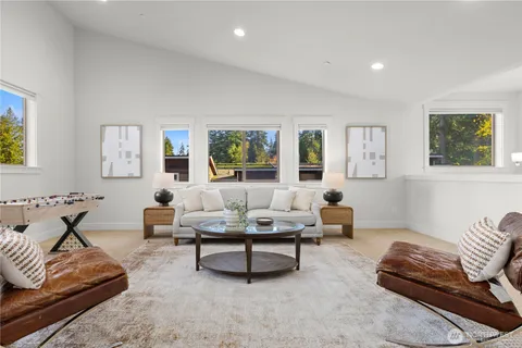 a living room with furniture lamp and window