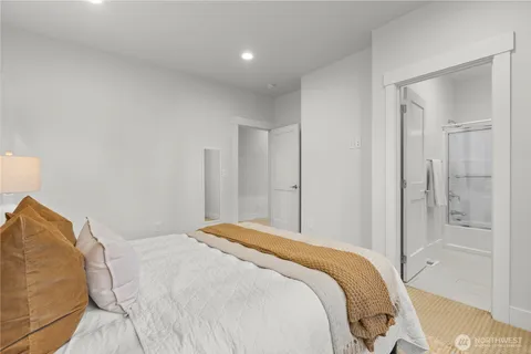 a bedroom with a bed and a shower
