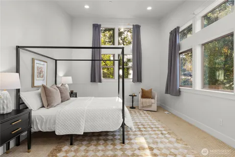 a bedroom with a bed and a couch