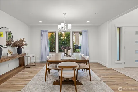 a view of a dining room with furniture window and outside view