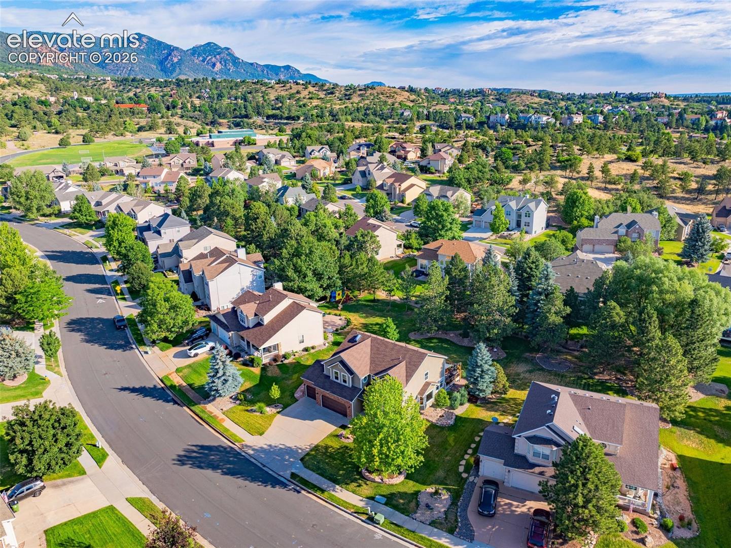 7985 Orchard Path Road Colorado Springs, CO 80919 - Photo 8 of 50 Community with mature trees and mountain scenery