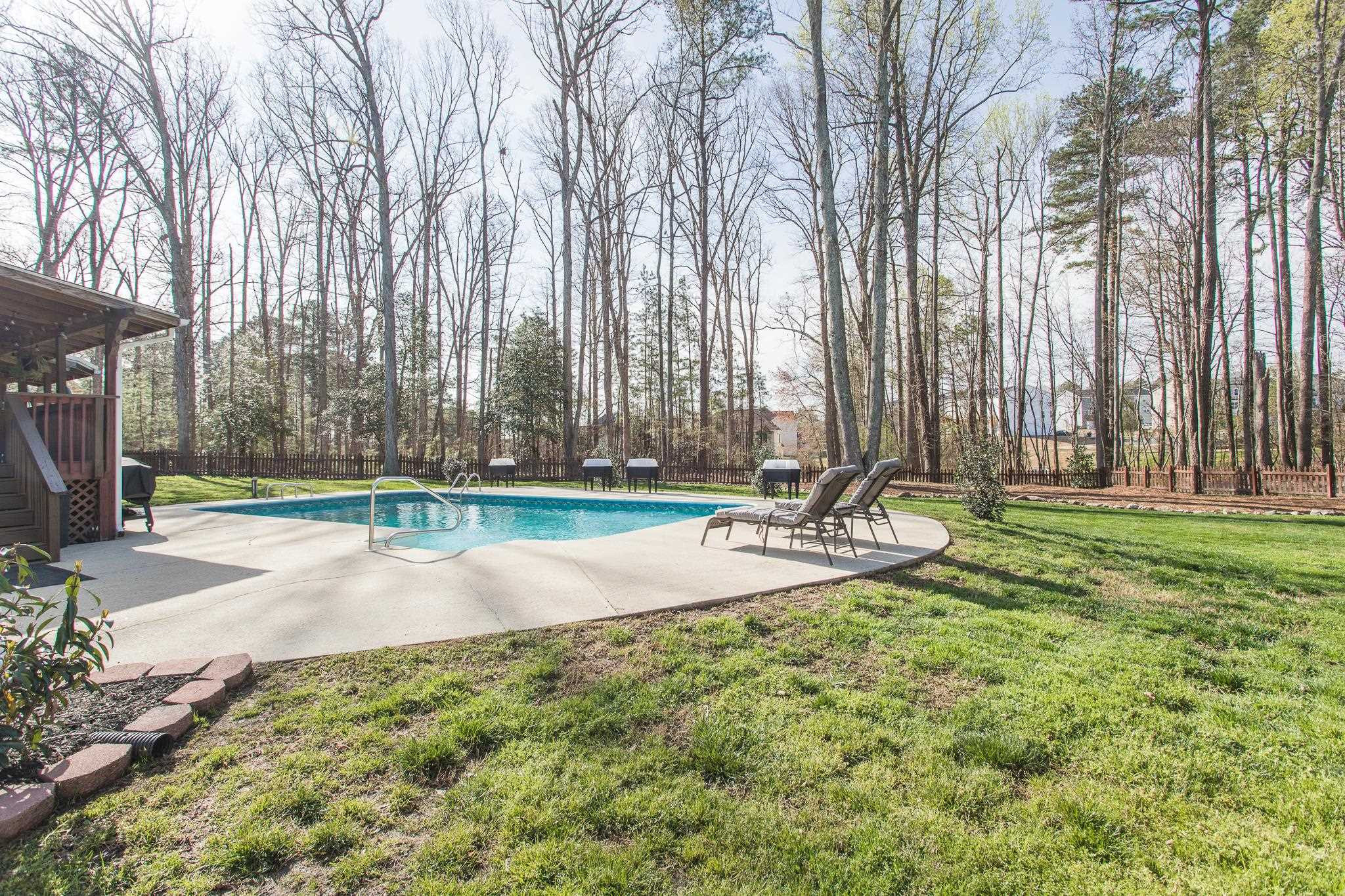 4900 Goosedown Court Raleigh, NC 27604 - Photo 4 of 41 The backyard is beautifully landscaped with an abundance of fruit trees and new garden boxes, as well as a pool and spa. Pool