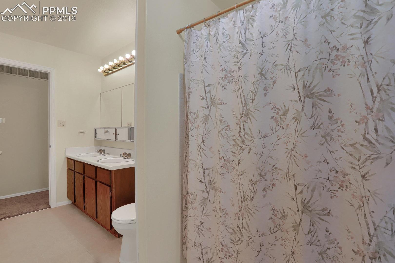 2409 Ranch Lane Colorado Springs, CO 80918 - Photo 16 of 25 Bathroom features tub/shower combo.