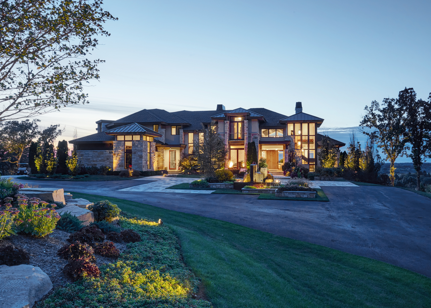 a view of a house with swimming pool lawn chairs and a yard