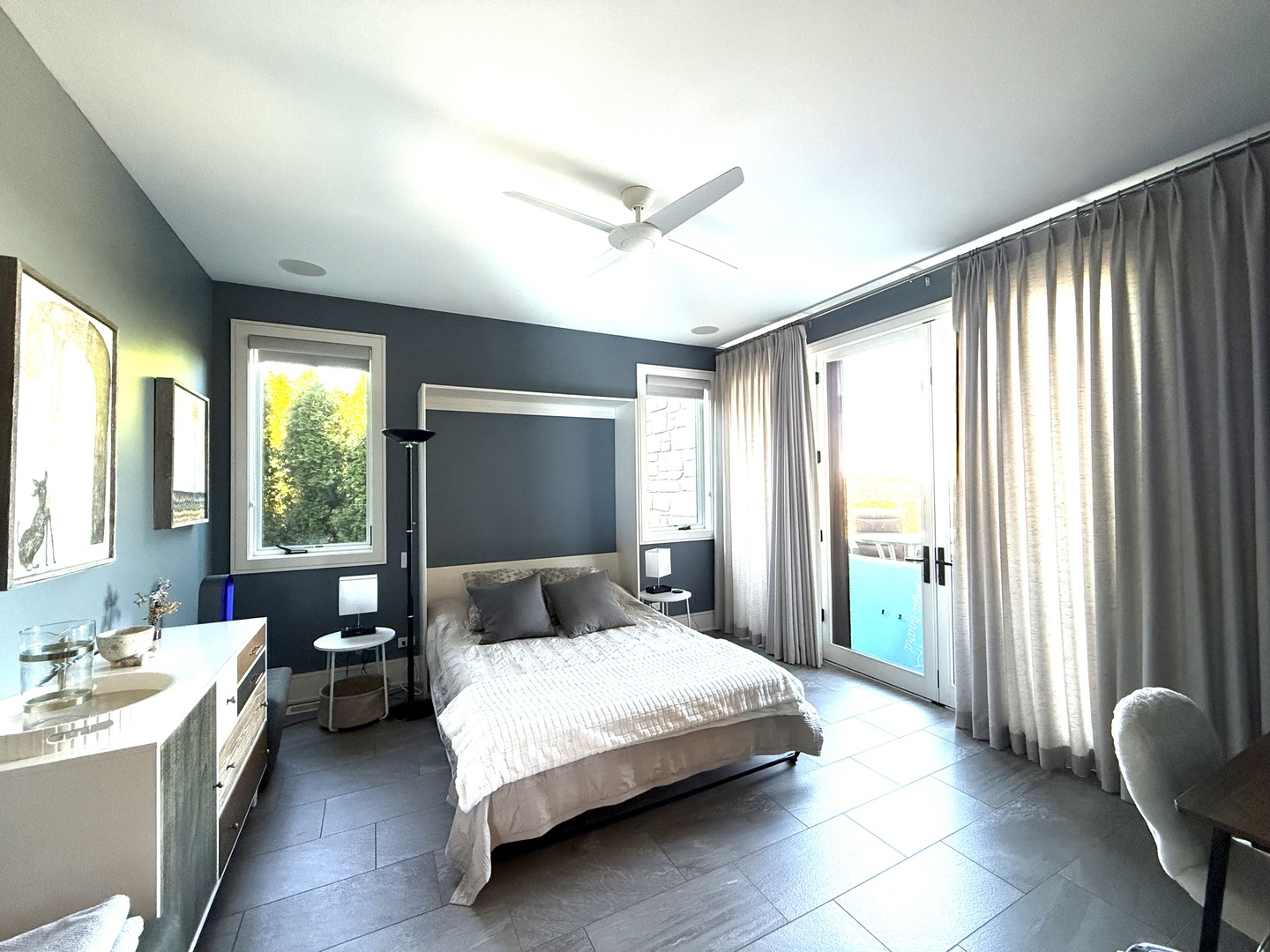 315 South Valley Hill Road Bull Valley, IL 60098 - Photo 28 of 86 a bedroom with a large bed and a large window