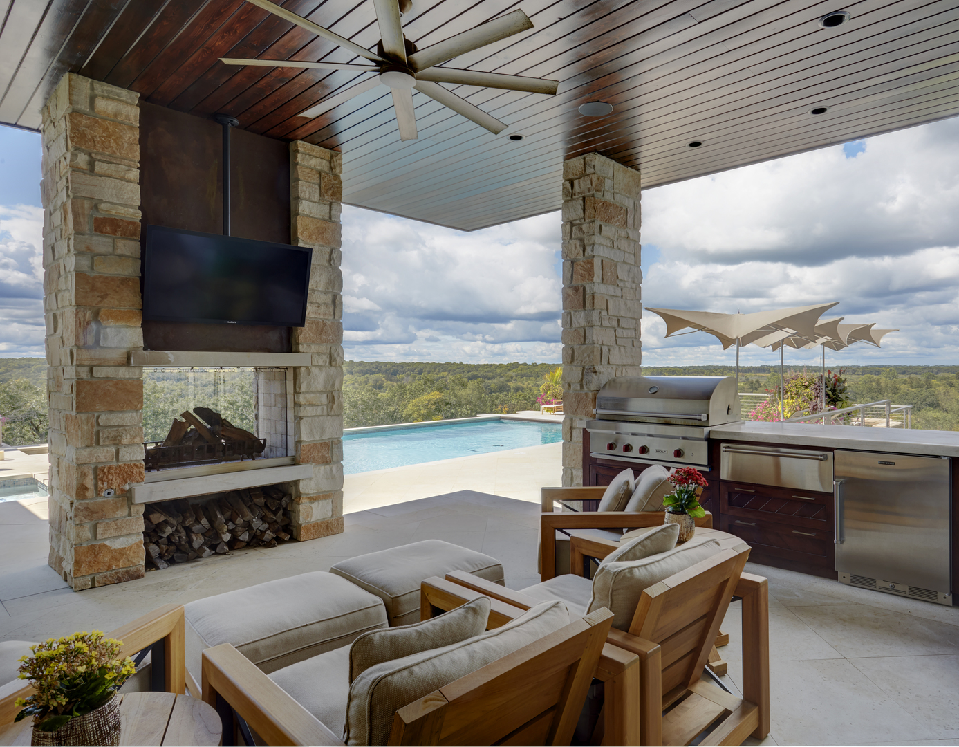 315 South Valley Hill Road Bull Valley, IL 60098 - Photo 56 of 86 a living room with furniture a flat screen tv and a floor to ceiling window