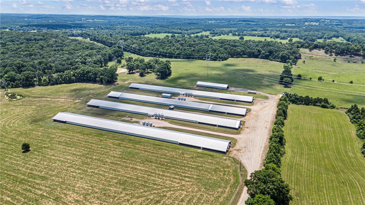 276 Charton Road Morrilton, AR 72110 - Photo 35 of 37 Expansive agricultural property featuring multiple large structures with metal roofs