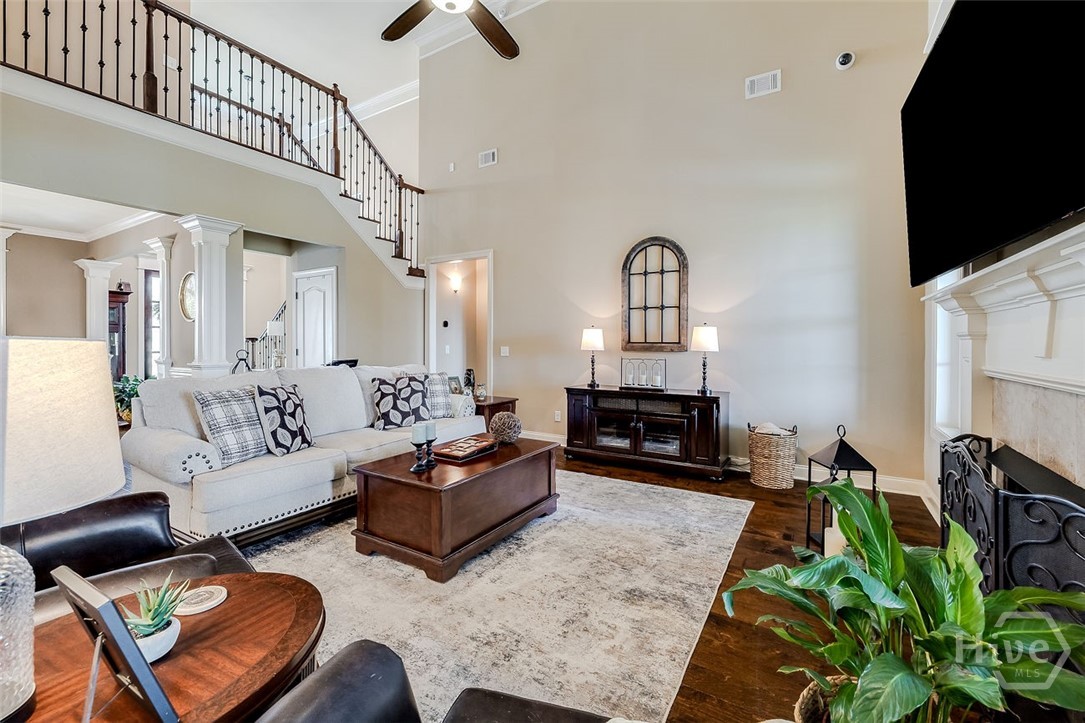 7 Reed Grass Lane Savannah, GA 31405 - Photo 10 of 70 spacious living room with fireplace, cathedral ceiling and cat walk to upstairs bedrooms