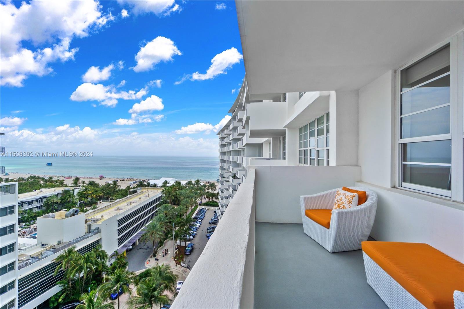 100 Lincoln Road, Unit 1202 Miami Beach, FL 33139 - Photo 1 of 23 a view of an ocean with a floor to ceiling window and potted plants