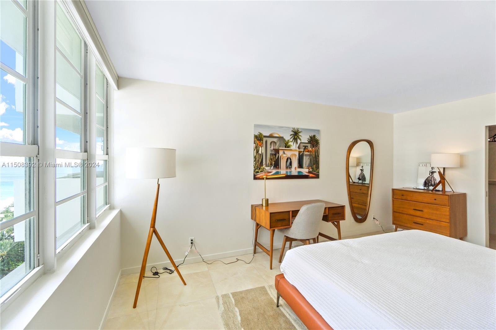 100 Lincoln Road, Unit 1202 Miami Beach, FL 33139 - Photo 12 of 23 a bedroom with furniture and a wooden floor