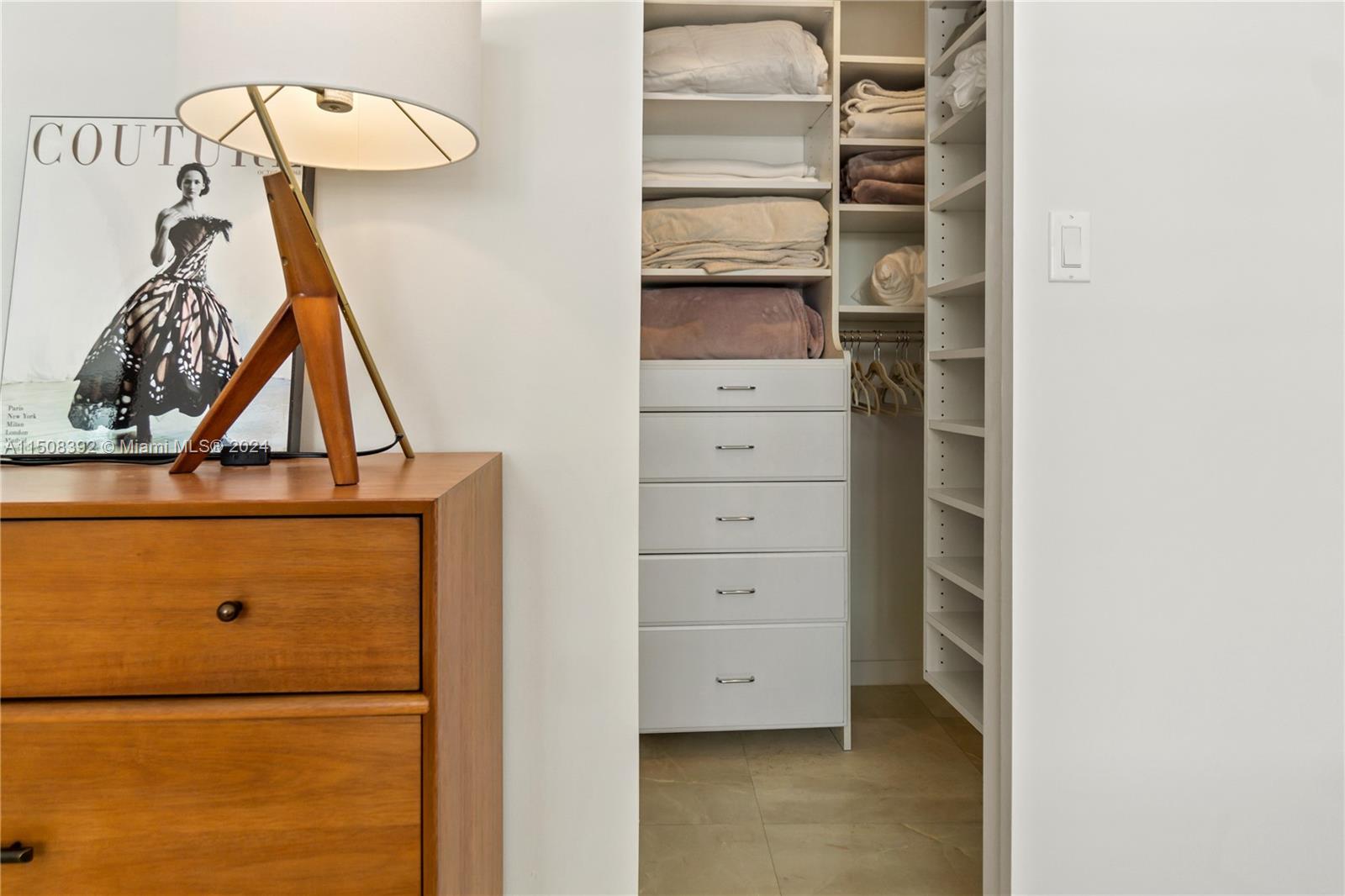 100 Lincoln Road, Unit 1202 Miami Beach, FL 33139 - Photo 15 of 23 a view of walk in closet with clothes