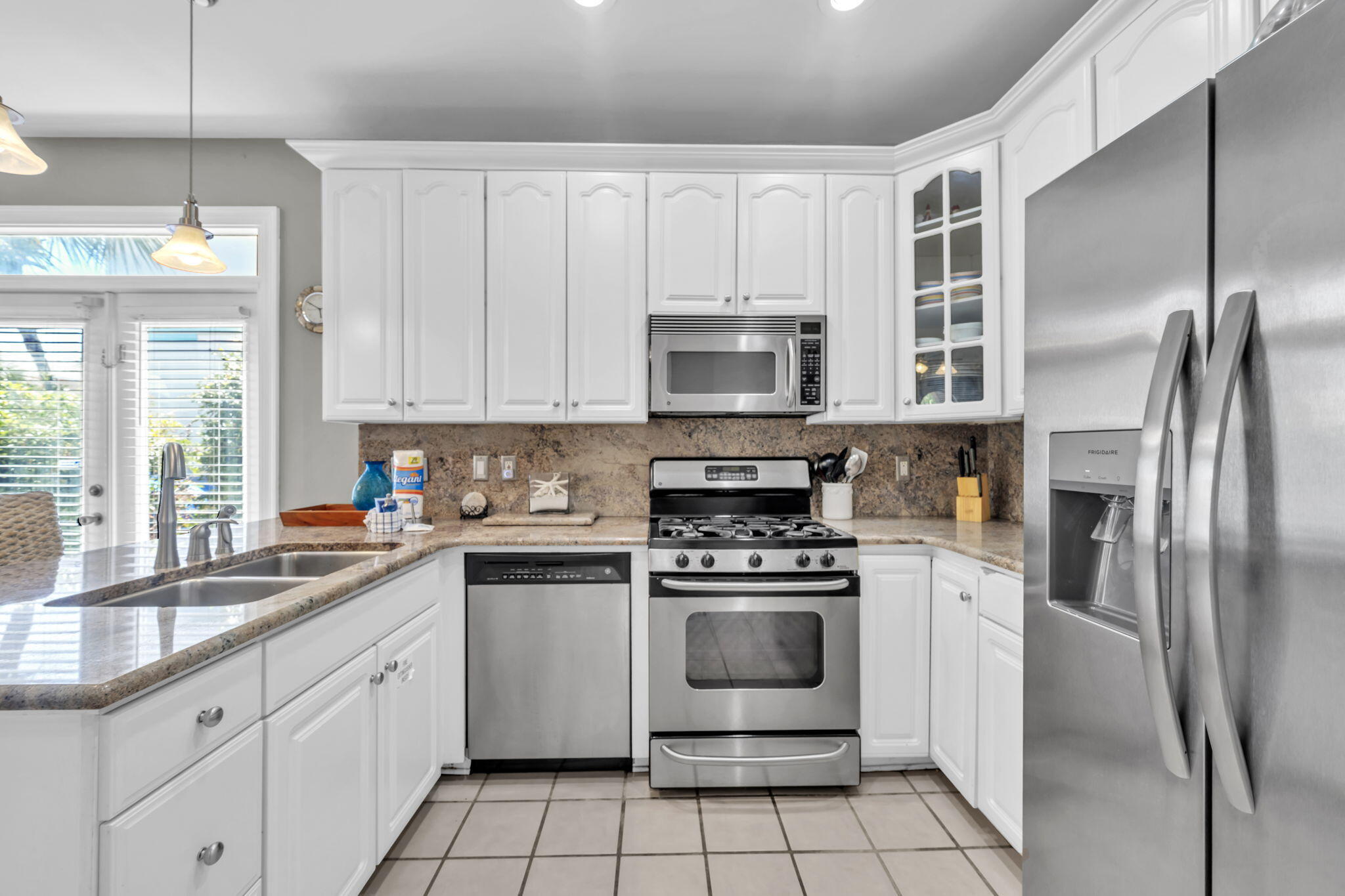 80 Terra Cotta Way Destin, FL 32541 - Photo 13 of 84 a kitchen with cabinets stainless steel appliances and a sink