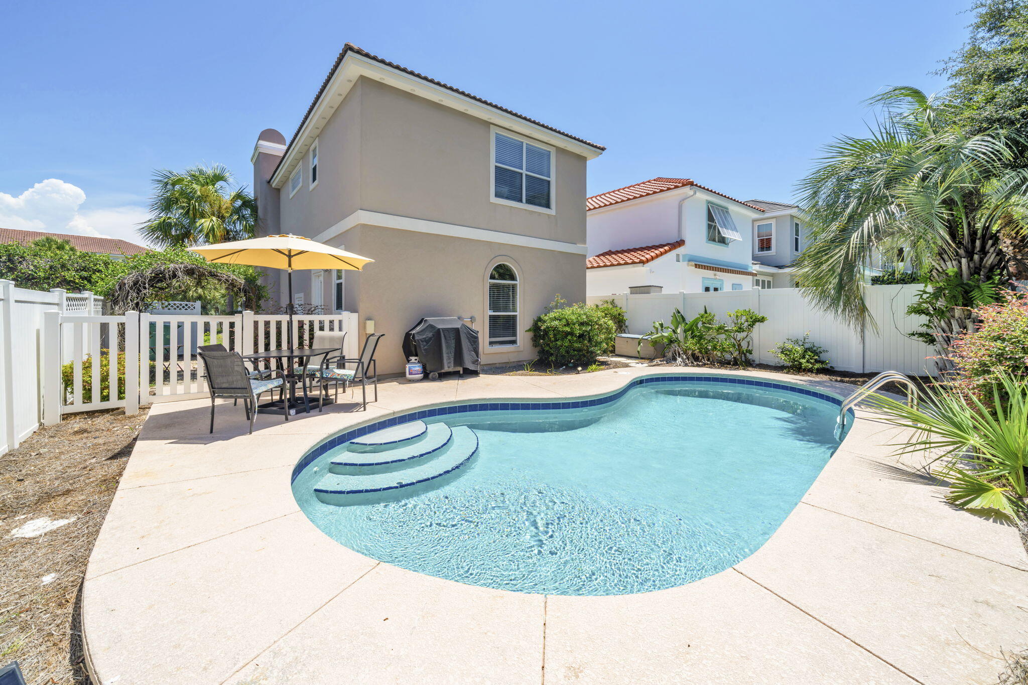 80 Terra Cotta Way Destin, FL 32541 - Photo 3 of 84 a view of a house with swimming pool and sitting area