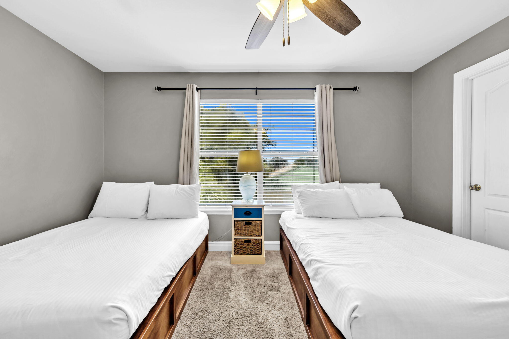 80 Terra Cotta Way Destin, FL 32541 - Photo 36 of 84 a bedroom with a large bed and a large window