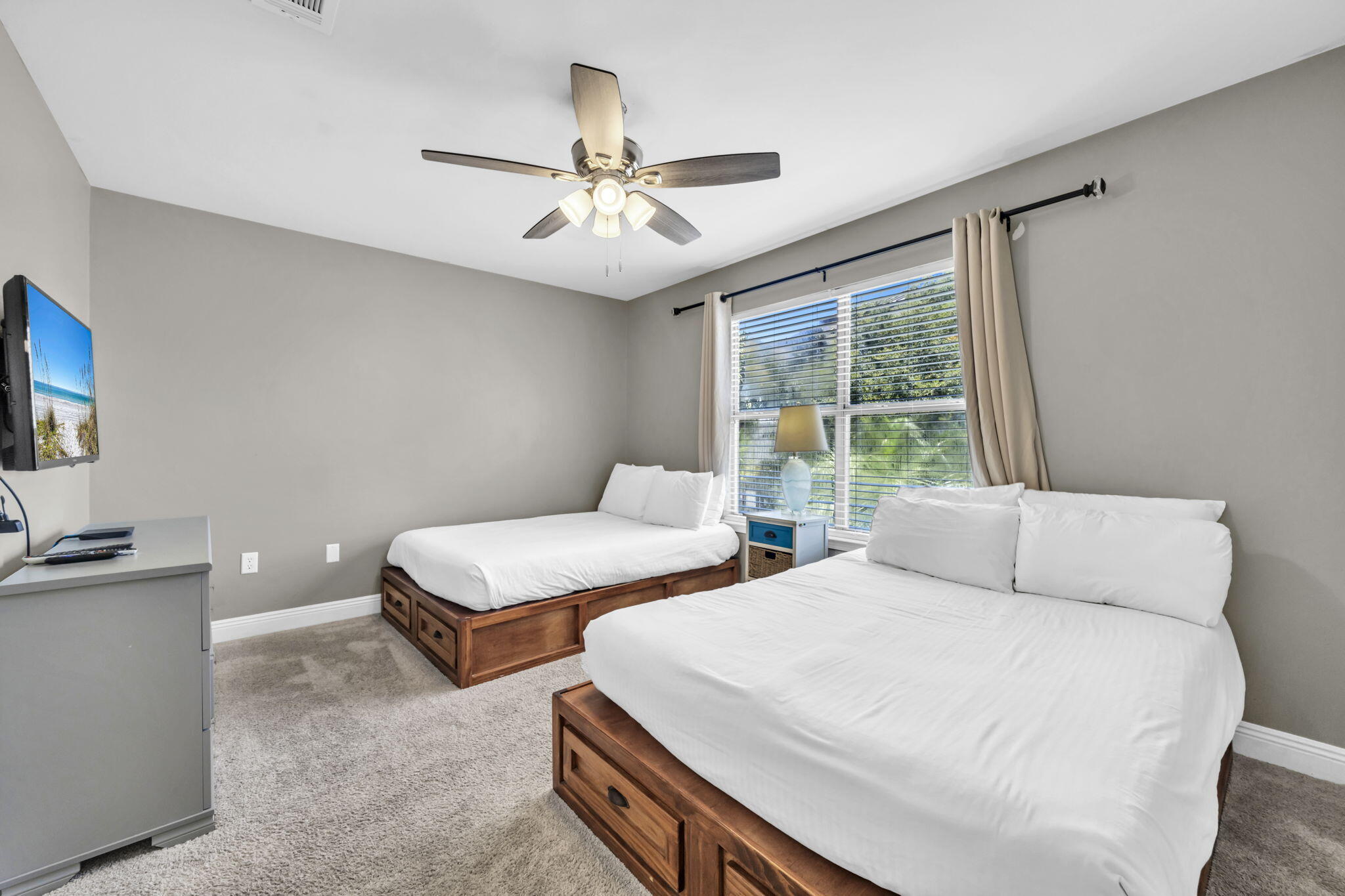 80 Terra Cotta Way Destin, FL 32541 - Photo 37 of 84 a bedroom with two beds and a chandelier