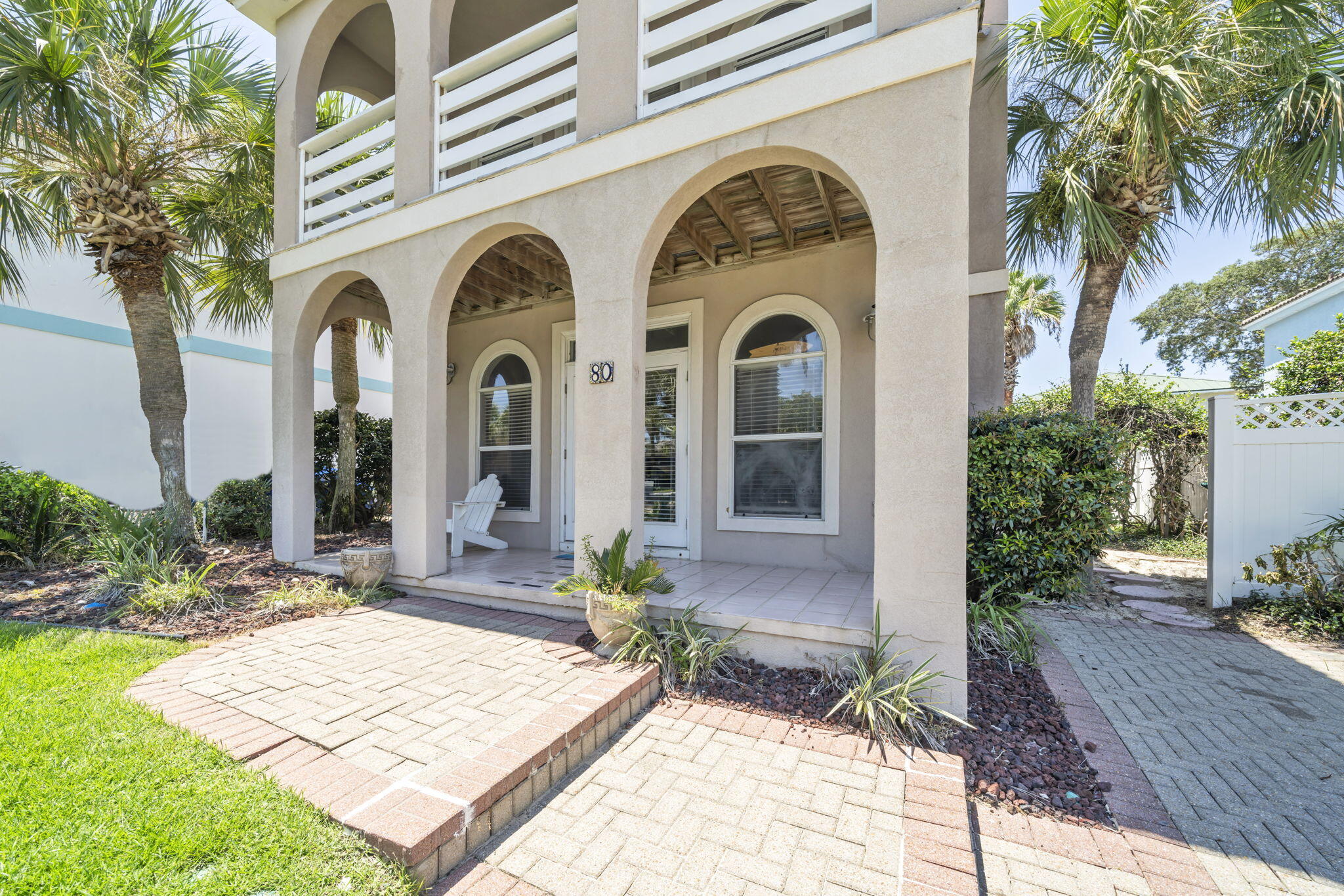 80 Terra Cotta Way Destin, FL 32541 - Photo 5 of 84 a front view of a house with garden