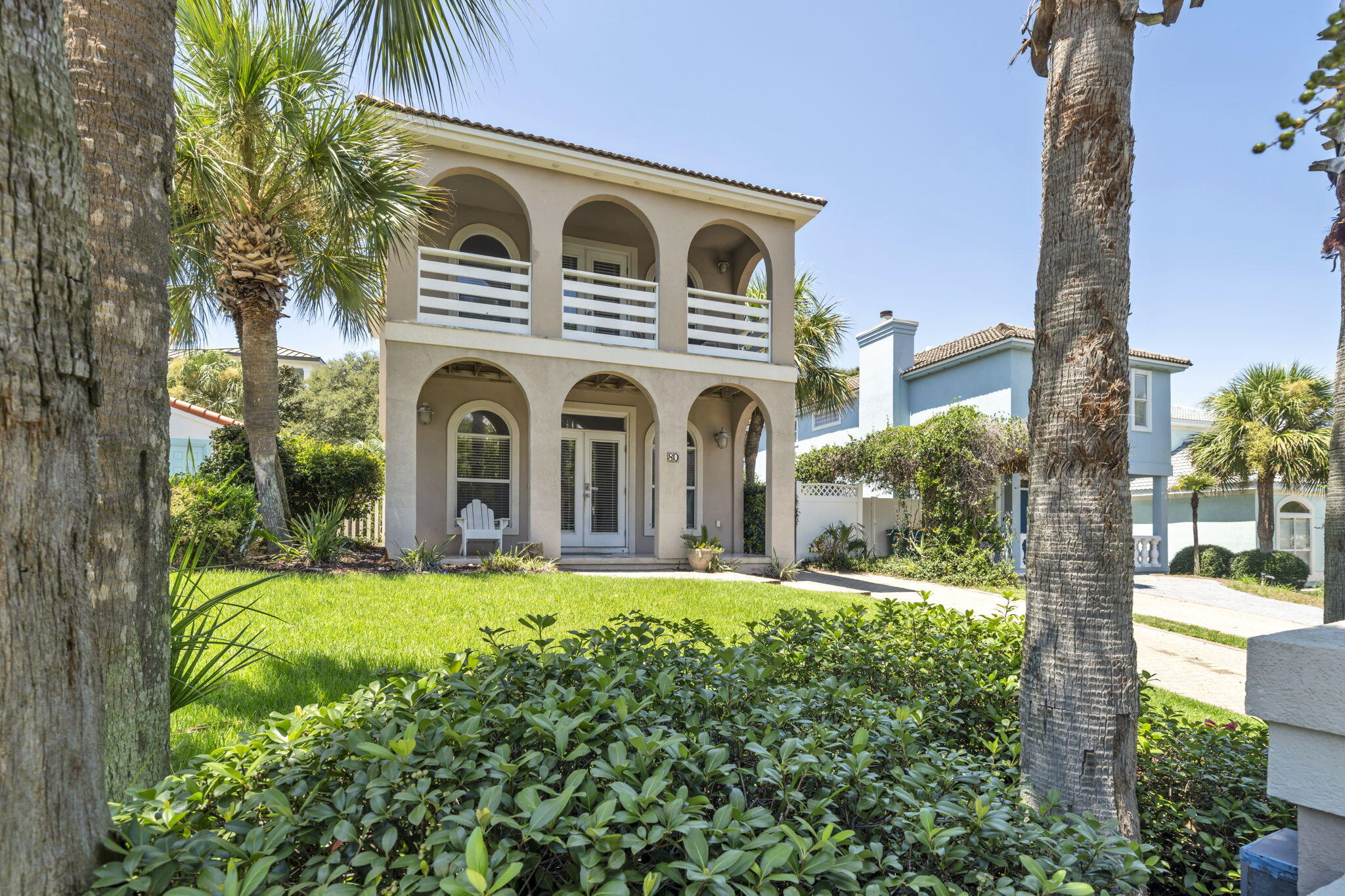 80 Terra Cotta Way Destin, FL 32541 - Photo 6 of 84 a front view of a house with a yard