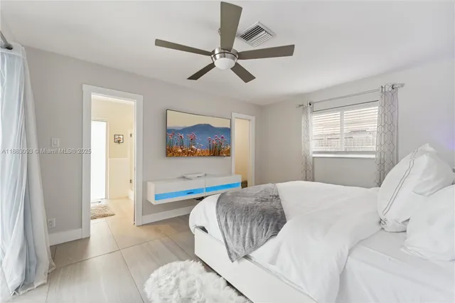 a bathroom with a granite countertop sink mirror toilet and bathtub