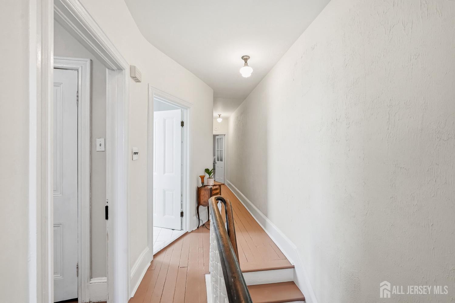 346 East Union Street Burlington, NJ 08016 - Photo 28 of 48 a view of a hallway with wooden floor and staircase