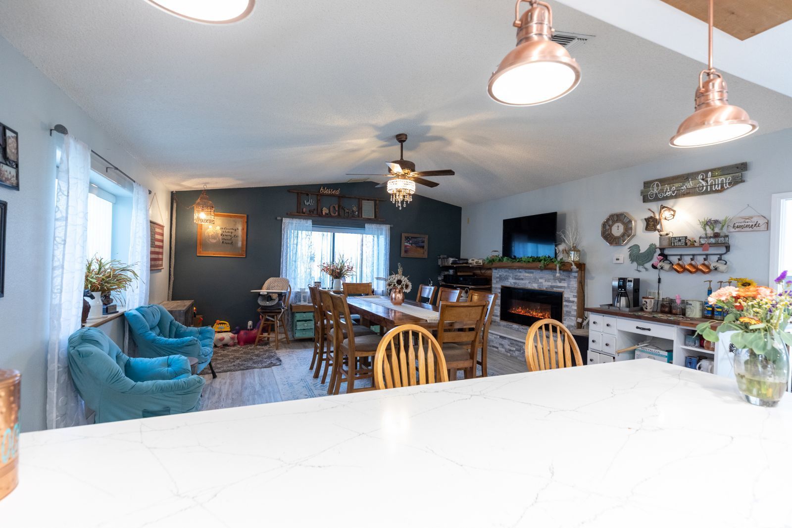 135 Brown Road Inyokern, CA 93527 - Photo 17 of 46 a view of a dining room with furniture and a chandelier