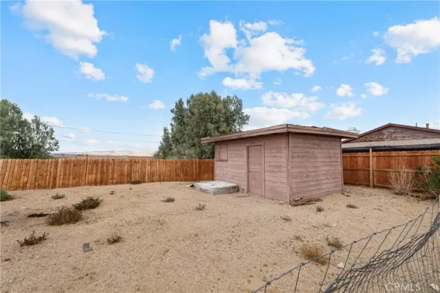 a view of backyard of a house