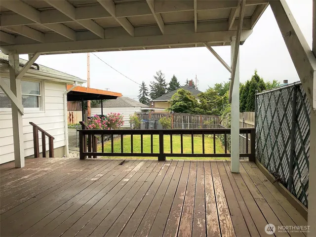 a view of balcony with wooden floor and outdoor seating