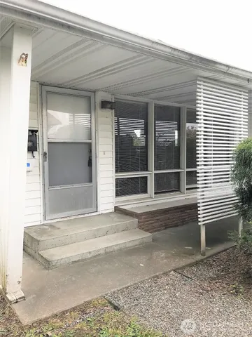 a view of a house with a tub and stairs
