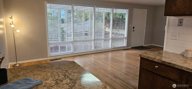 a view of a kitchen with a sink and a window