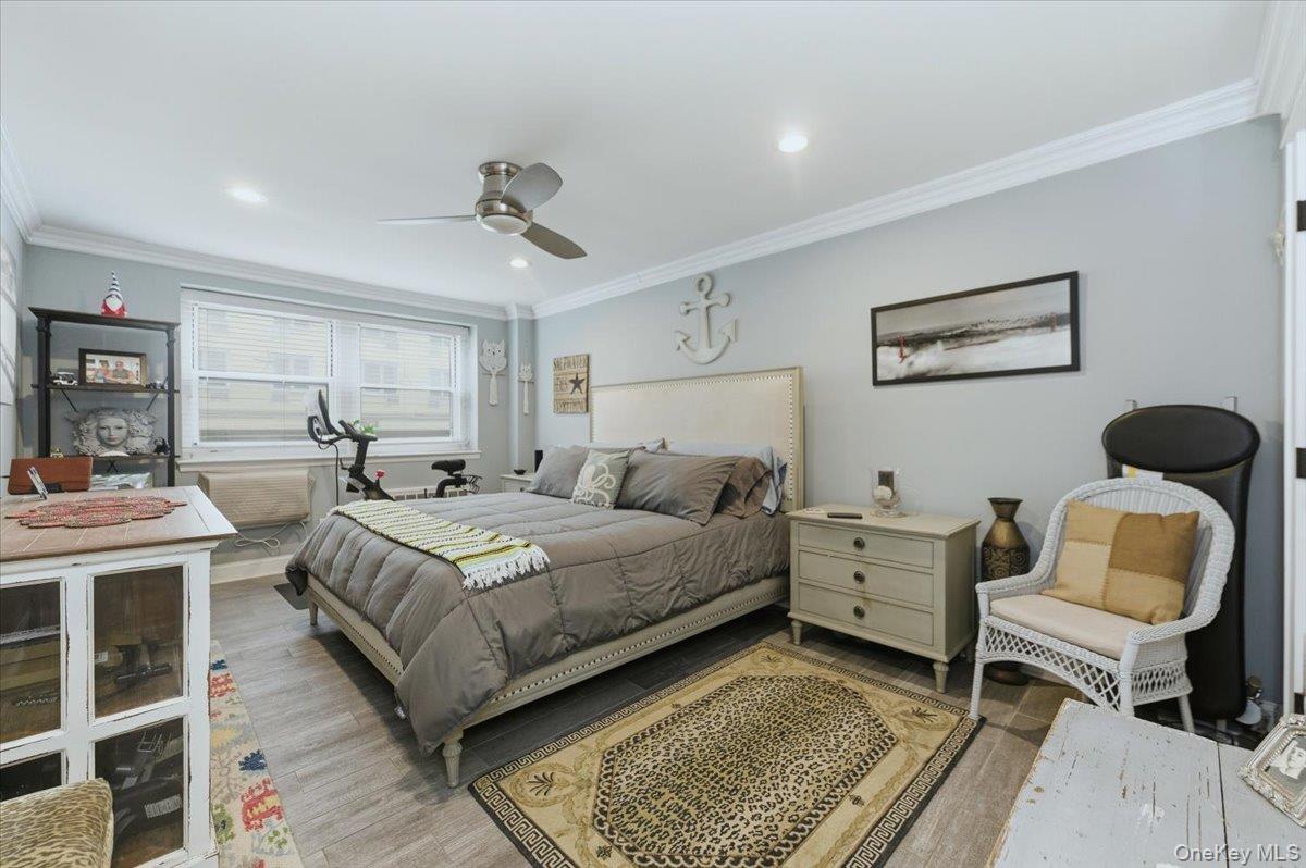 711 Shore Road, Unit 1J Long Beach, NY 11561 - Photo 11 of 22 a bedroom with a bed and window