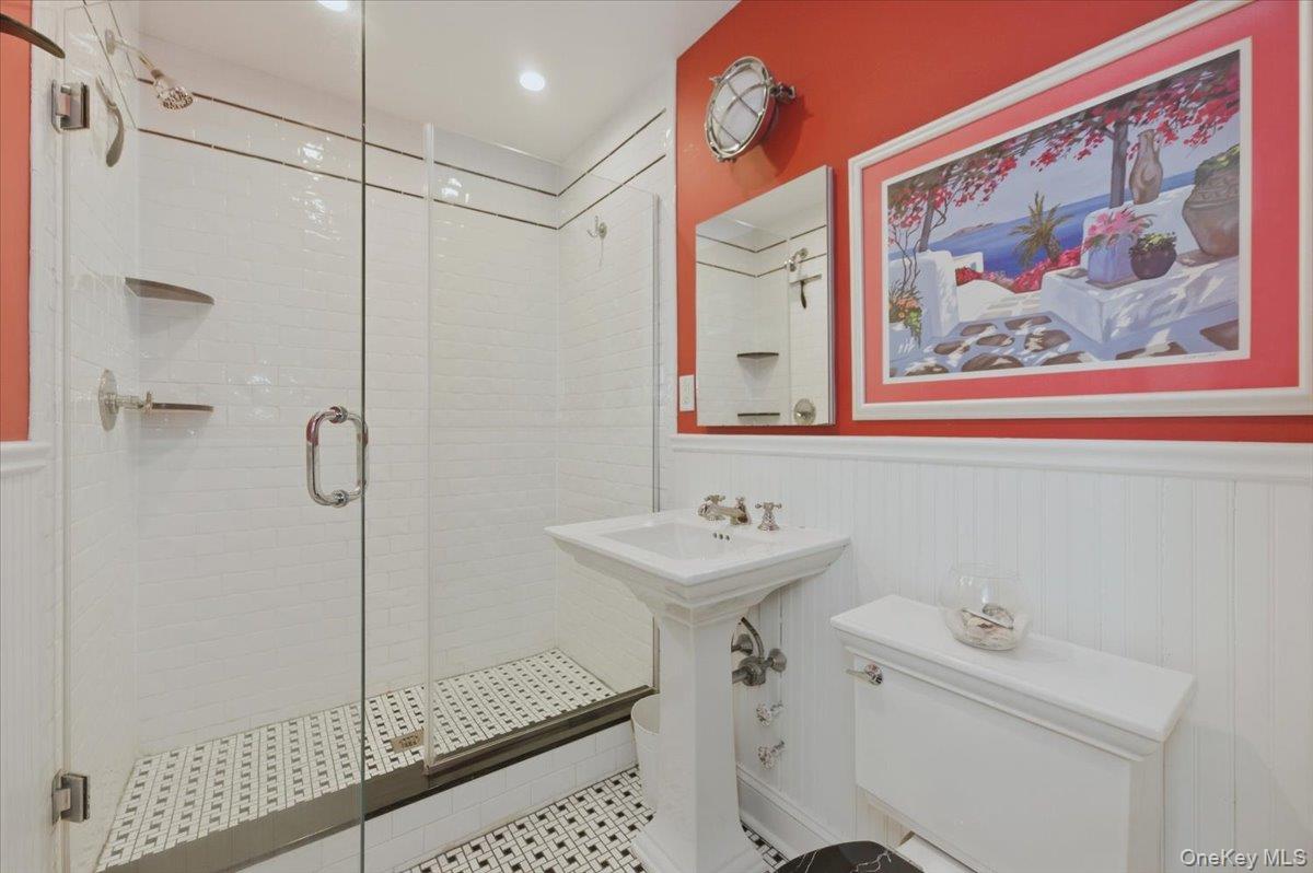 711 Shore Road, Unit 1J Long Beach, NY 11561 - Photo 14 of 22 a bathroom with a shower and a sink