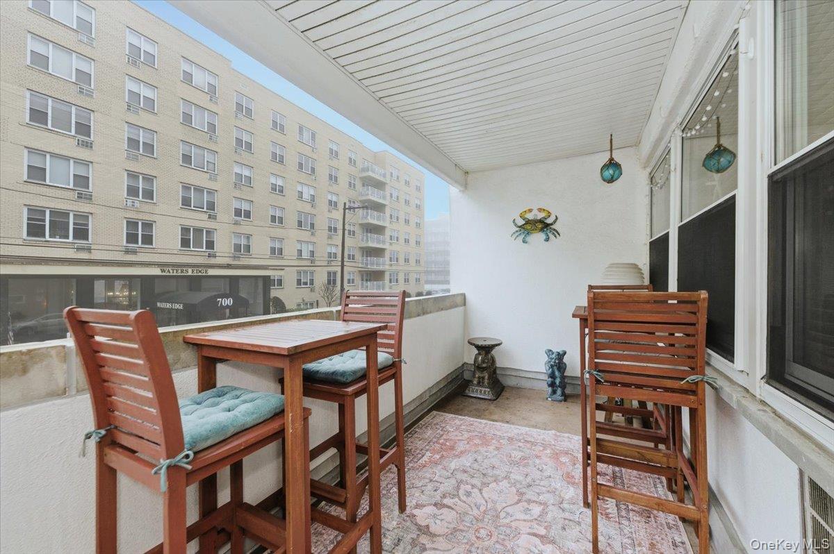 711 Shore Road, Unit 1J Long Beach, NY 11561 - Photo 16 of 22 a reading room with furniture and wooden floor