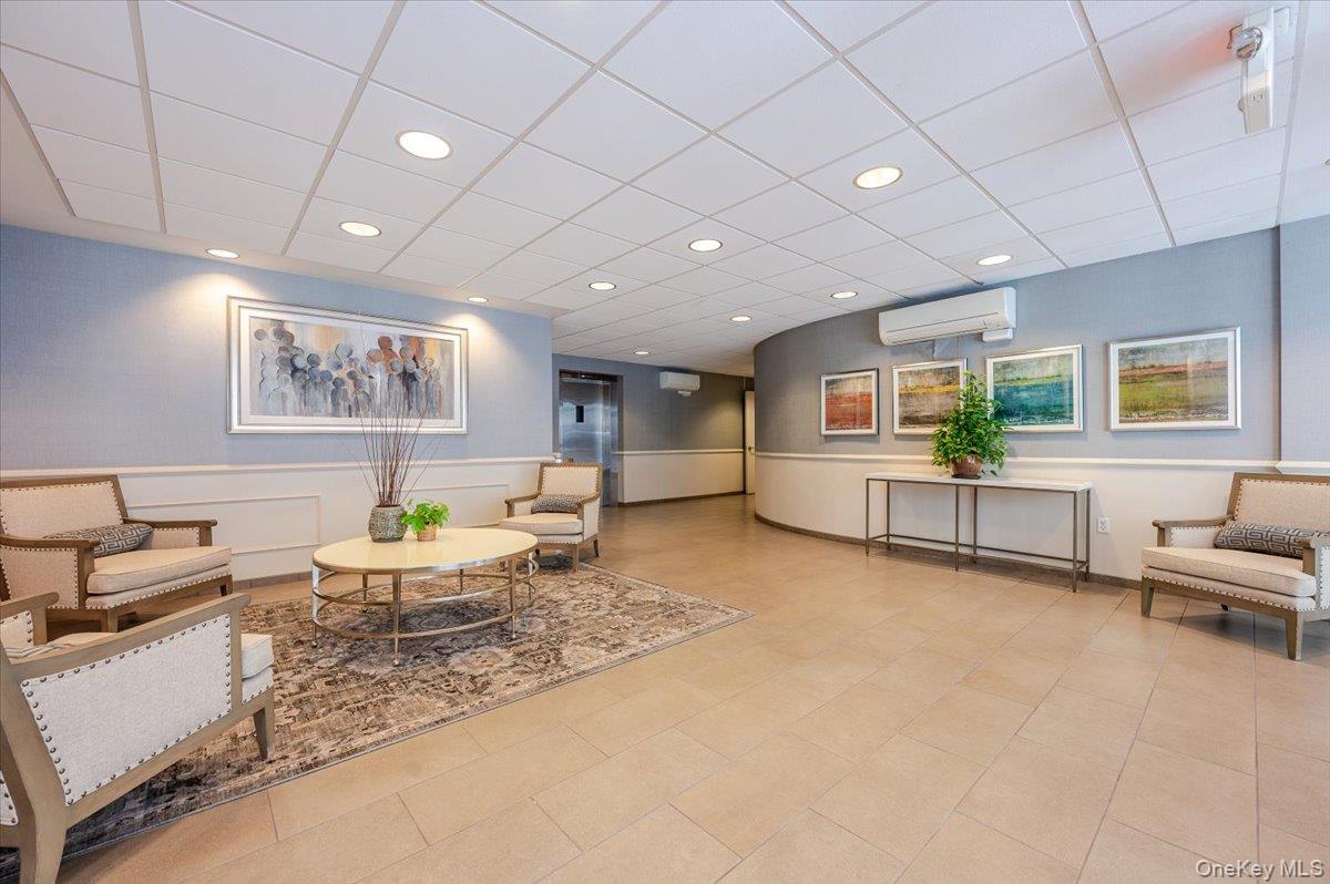 711 Shore Road, Unit 1J Long Beach, NY 11561 - Photo 21 of 22 a living room with furniture and a wooden floor
