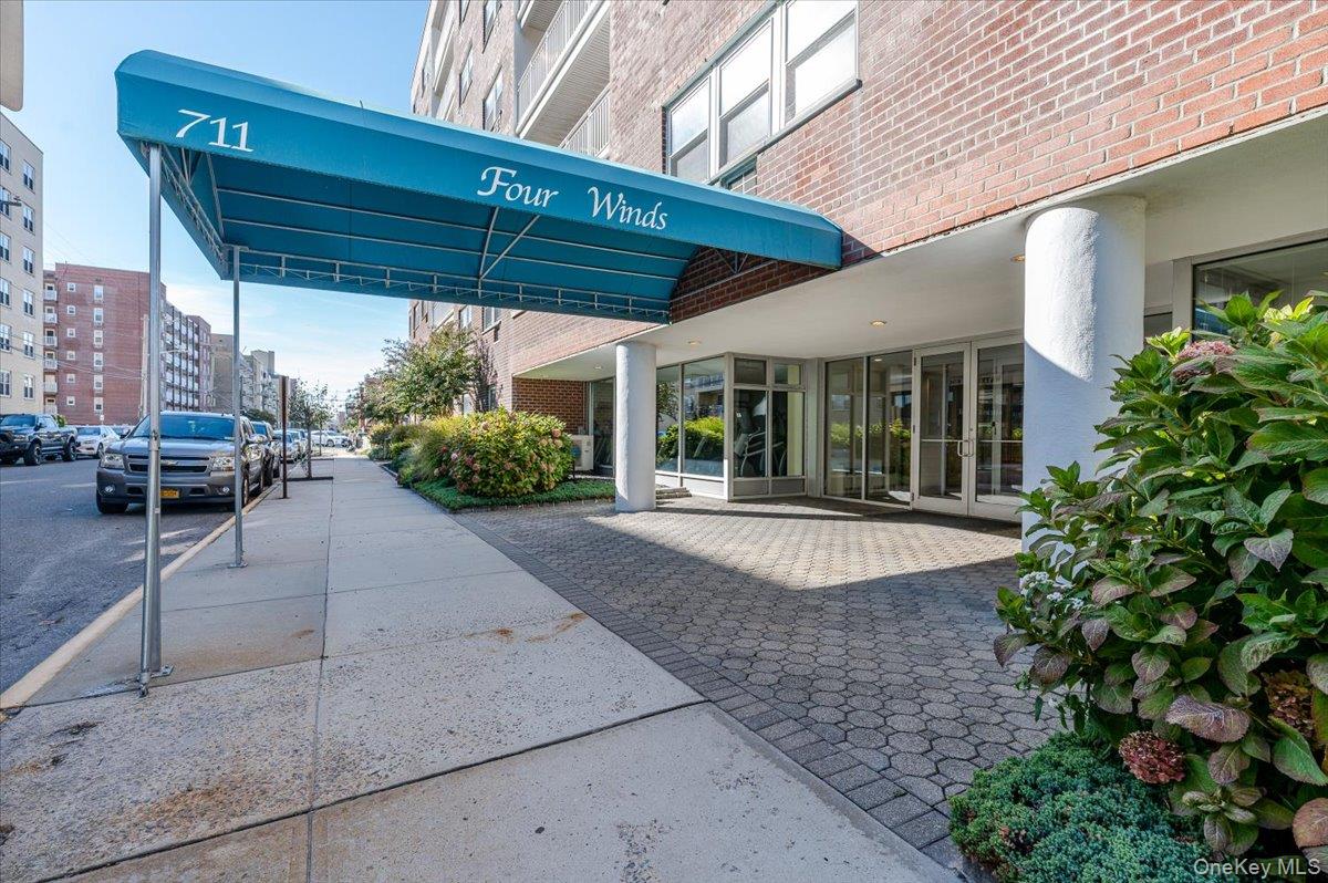711 Shore Road, Unit 1J Long Beach, NY 11561 - Photo 22 of 22 front view of a house with a patio