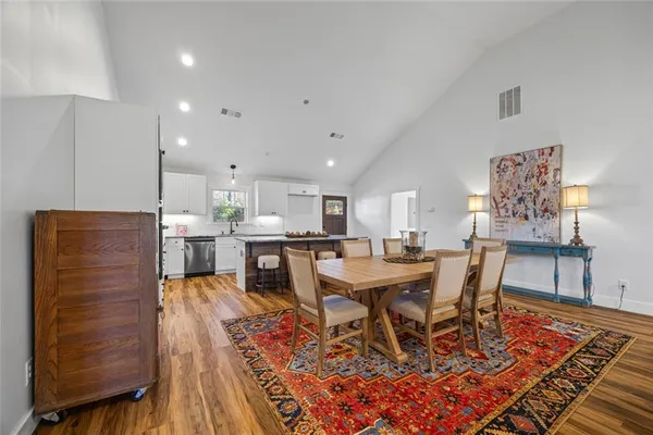 a kitchen with granite countertop cabinets stainless steel appliances and a window