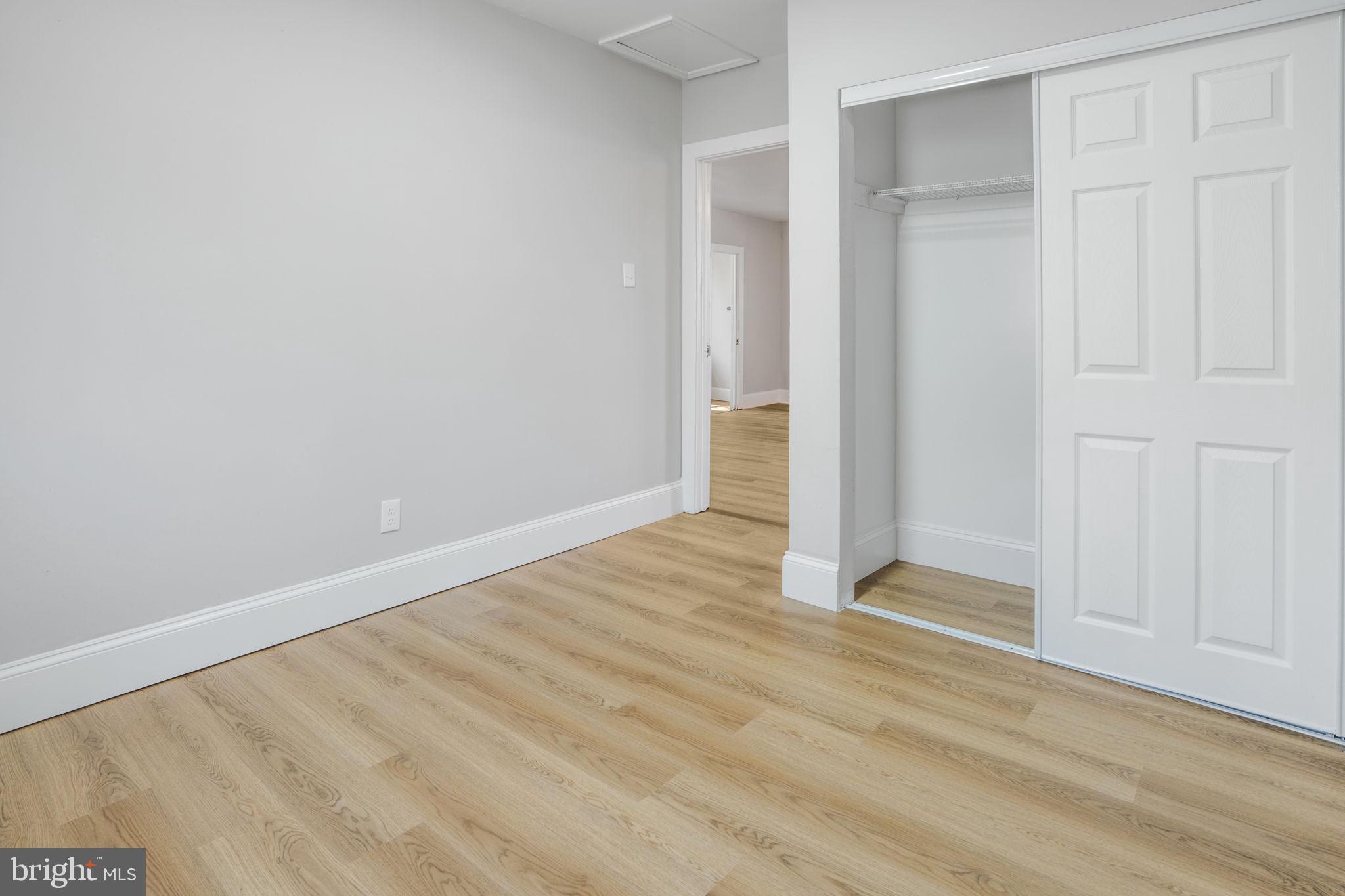 246 Chestnut Street Mount Holly, NJ 08060 - Photo 13 of 25 a view of an empty room with wooden floor