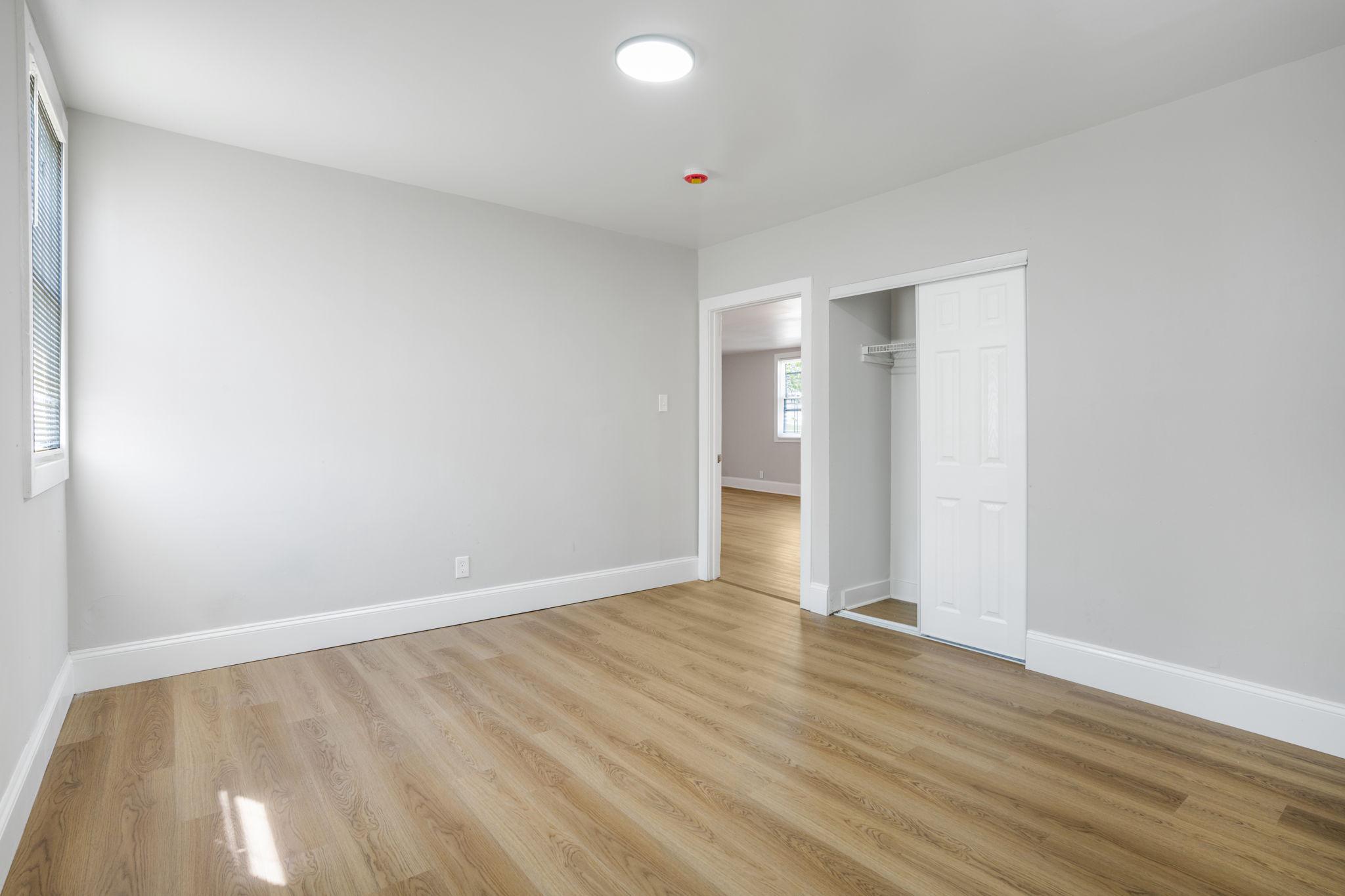246 Chestnut Street Mount Holly, NJ 08060 - Photo 15 of 25 a view of an empty room and wooden floor