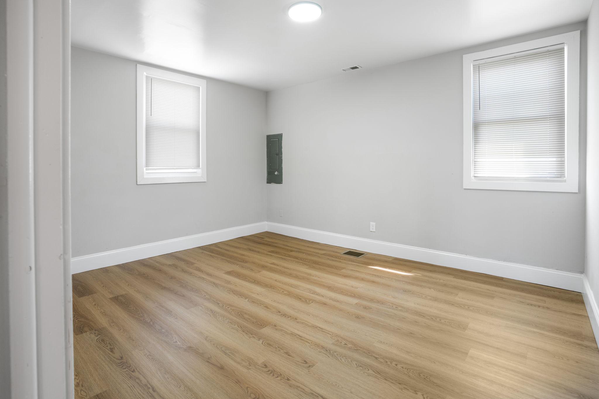 246 Chestnut Street Mount Holly, NJ 08060 - Photo 16 of 25 wooden floor in an empty room with a window