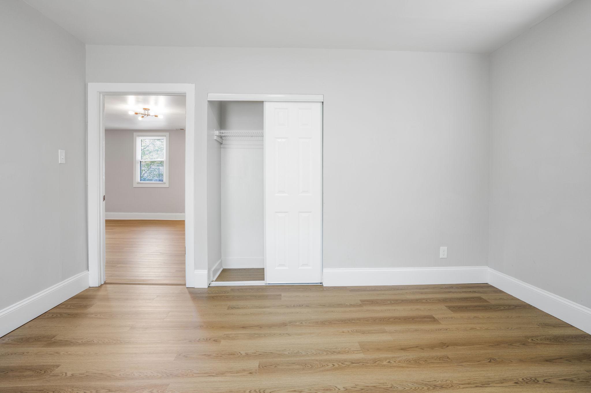 246 Chestnut Street Mount Holly, NJ 08060 - Photo 17 of 25 a view of an empty room with wooden floor and windows