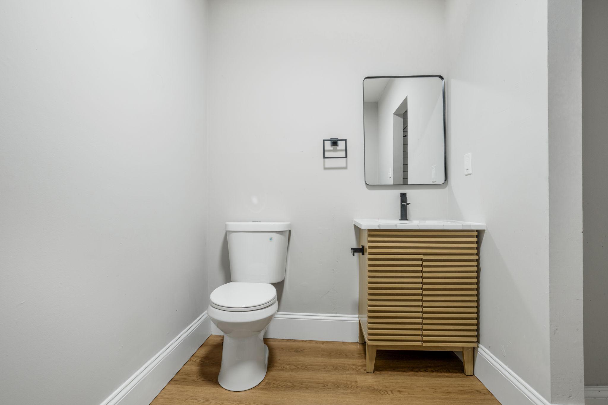 246 Chestnut Street Mount Holly, NJ 08060 - Photo 19 of 25 a bathroom with a toilet and a sink