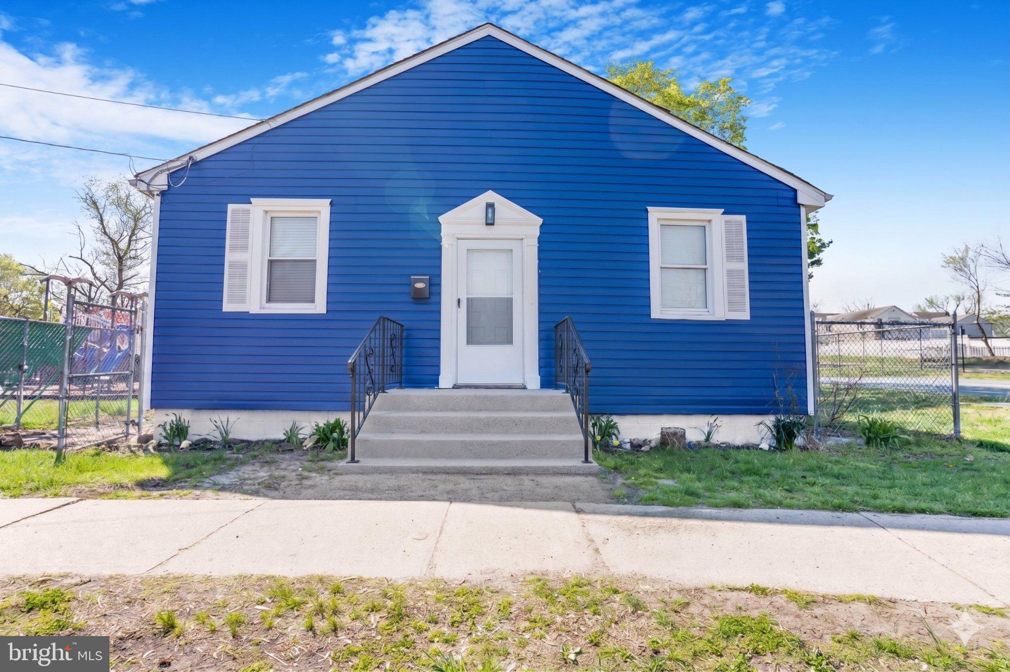 246 Chestnut Street Mount Holly, NJ 08060 - Photo 2 of 25 a front view of a house with a yard